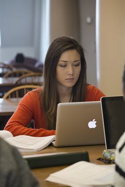 Student studying on a laptop